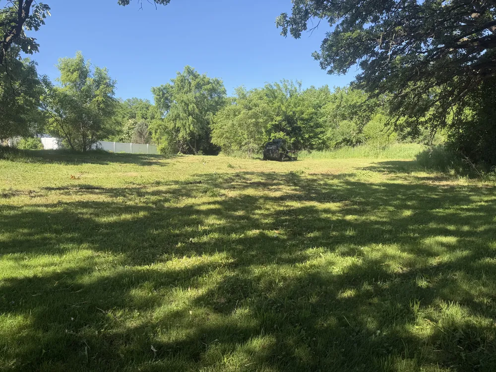 Reclaimed acreage with preserved trees and a clean finish by Proper Grounds
