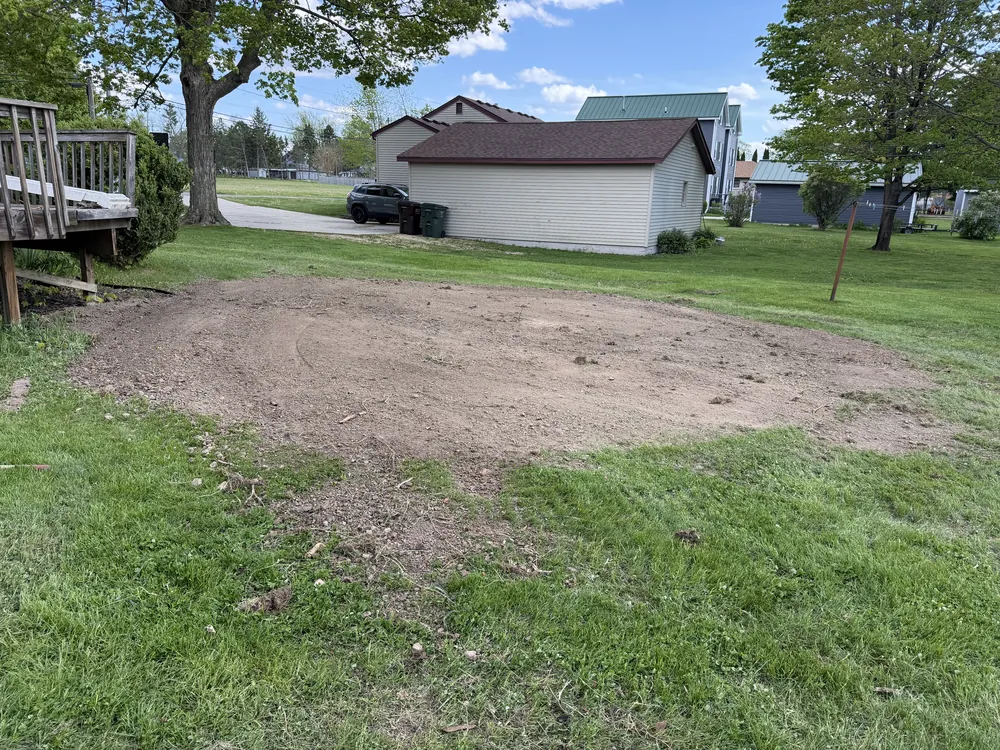 Cleared and graded building pad prepared next to a home in southern Wisconsin